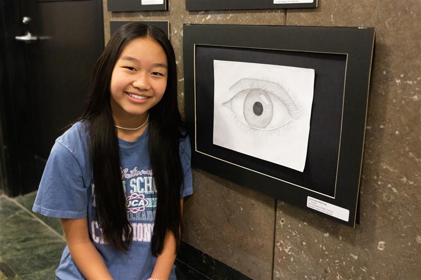 Students and their family at an art show
